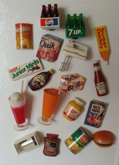 a refrigerator door covered in lots of different types of food and condiments on it