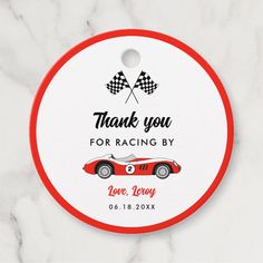 a red and white race car tag with the words thank you for racing by