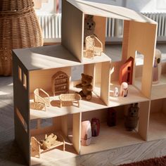 the doll house is made out of wood