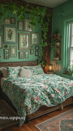 a bedroom with green walls and pictures on the wall