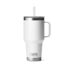 a white yeti cup with a straw in it