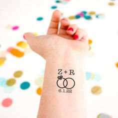 a woman's arm with a tattoo on it that says, zr and c