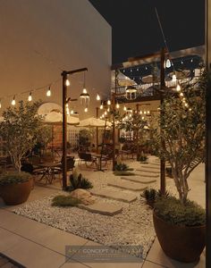 an outdoor patio with potted plants and lights