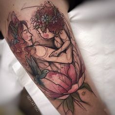 a woman with flowers on her head is sitting in front of a bird and flower tattoo