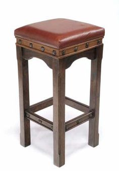 a wooden stool with leather seat on white background