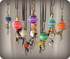 a bunch of different colored beads hanging from hooks