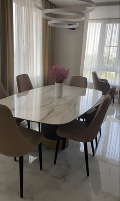 a dining room table with chairs around it