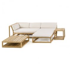 an outdoor furniture set with white cushions