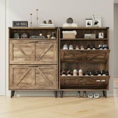 a wooden cabinet filled with lots of shoes next to a white wall and hardwood floor