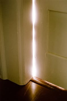 an open door with light coming through it