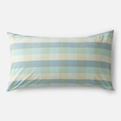 a blue and white pillow with a checkered pattern on it