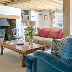 a living room filled with furniture and a fire place