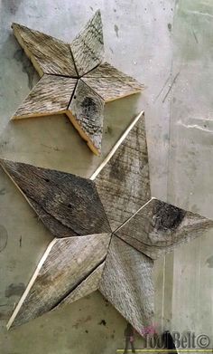 three wooden stars are arranged on the wall