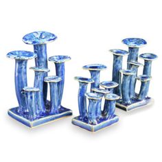 a group of blue vases sitting next to each other