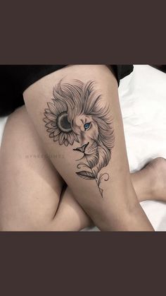 a woman's thigh with a tattoo of a lion and sunflower on it