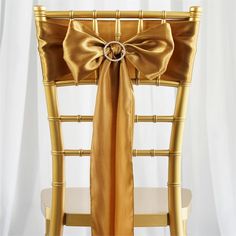 a gold chair with a bow on it