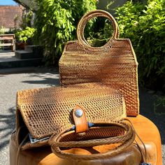 This versatile rattan handbag features a unique top handle design, making it perfect for any occasion. Free Shipping on all rattan bags with handles. Crafted from Ata Grass sourced from Indonesia. Each item is handmade in a small industry in Bali, Indonesia. Smoking method used to achieve a natural golden brown color; a slight smoke scent may be present upon arrival but will dissipate over time. 100% Handmade, with possible slight variations in size and color. Dimensions: Medium: 22.5 cm x 8.5 cm x 21.3 cm (8.8" x 3.3" x 8.3") – excluding circle handle. Top Handle: 11.5 cm (4.5"). Batik Lining inside, with each bag featuring unique patterns and colors. Production time: Approximately seven to ten business days per order. The intricate weaving paired with a vibrant fabric lining adds a touch Metallic Cowhide Rug, Rattan Bags, Golden Brown Color, Circle Handle, Fur Jacket Women, Rattan Handbags, Patchwork Cowhide Rug, Brindle Cowhide, Rattan Weave