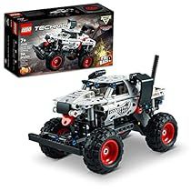 the lego technic monster truck has red wheels and is next to it's box