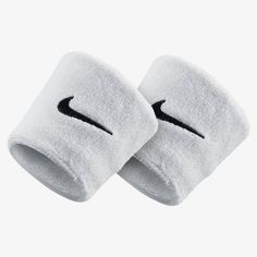 two white nike wristbands with black logo on the side and one in the middle