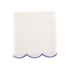 a white napkin with blue scalloped edges