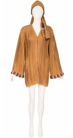 "The 1970s Kay Cosserat cardigan and scarf set was made in England of a 80% wool/20% polyamide pleated knit blend in light terracotta with a striped interior and trim. It has drop shoulders with wide sleeves and a shallow pocket on each side. The cardigan fastens with a hook-and-eye in the front. It comes with a detached 57\" x 5\" scarf. It's in excellent condition, clean and ready to wear. Measurements: Bust - 40\" Waist - 40\" Hips - 44\" Shoulders - 18\" Sleeves - 25\" Length -  33\" IMPORTA Light Terracotta, Striped Interior, Pleated Knit, Scarf Set, Wool Knit, Wide Sleeves, The 1970s, Cardigans For Women, Knit Cardigan