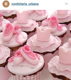 cupcakes decorated with pink frosting and bows