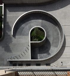 an aerial view of a circular building with stairs