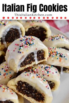 italian fig cookies with white icing and sprinkles on a platter