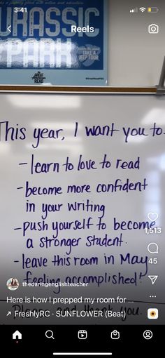 a white board with writing on it in front of a sign that reads, this year i want you to learn to love to read