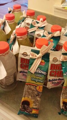 several bottles of sunflower seed oil are on the counter top next to each other