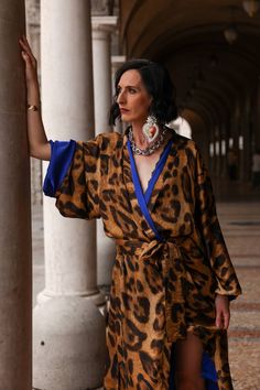 Leopard  kimono robe 👘made by Monelia LEOPARD PRINT print With fuchsia trim. Handmade in Italy.  You can wear a kimono with a belt as a dress or as a jacket without a belt. The designer takes part in Italian fashion show. The outfit is appropriate for city walks, New York street style outfit.   Leopard kimono robe One size M-XL Mono earring Large silver tone chain Hematite beads You can buy only kimono or complete with designer jewelry for this set. I give old pieces new life by using antique m Elegant Kimono With Kimono Sleeves As A Gift, Elegant Kimono As A Gift, Elegant Kimono With Kimono Sleeves For Gift, Leopard Print Kimono Outfit, Animal Print Kimono, Snake Print Kimono Outfit, Full Length Leopard Robe With Hood, Leopard Kimono, Kimono Outfit