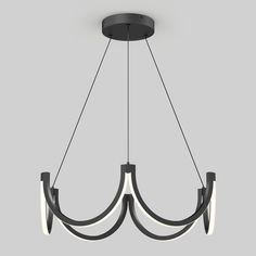 a black chandelier with three lights hanging from it's center and one light on