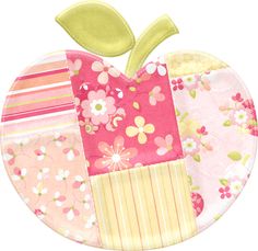 an apple shaped paper plate with patchwork and flower designs on the front, along with a green leaf