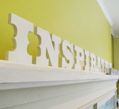 the letters are cut out and placed on the mantle