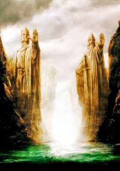 two large statues standing in the middle of a body of water surrounded by mountains and rocks