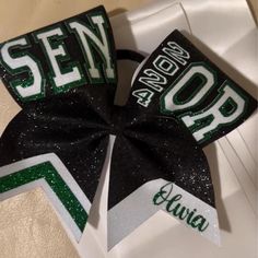 Custom Made 2025 Senior Cheer bow. Black base with your choice of two other colors. Senior Cheer Bow Ideas, Cheer Bows Ideas, Senior Bows, Senior Cheer Bows, Cheer Spirit Sticks, Cheer Apparel, Cute Cheer Bows, Senior Sash, Spirit Sticks