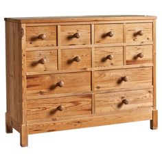 a wooden dresser with many drawers and knobs