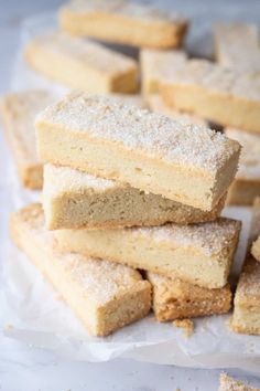 several pieces of cake sitting on top of wax paper