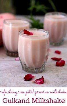 three glasses filled with milk and rose petals