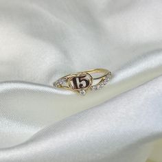 Real 14K Two Tone Gold 15 Years Birthday Cubic Zirconia Heart Quinceanera Ring, 15 Anos Birthday Jewelry Gift for Girls ✅ITEM SPECIFICATIONS:  ➤Width: 7MM  ➤ Average Weight: 1.75gr.  ➤ Type: Rings/Quinceanera ✅ PREMIUM SOLID 14K GOLD:  Crafted with durable high quality materials, gems, & stones; Hand-Stamped for Authenticity & FTC Law Approved. Easy to clean & polish and won't permanently tarnish or rust! Most 14k rings can easily be resized by your local jeweler! ✅ BEAUTIFUL CRAFTSMANSHIP:  Our Quinceanera Jewelry Rings, 15 Gold Rings, Quince Rings 15 Gold, Rings For Quinceanera, Quinceñera Rings, 15 Rings Quinceanera Gold, Xv Rings, Quince Rings Gold, Rings Quinceanera