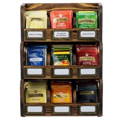 a wooden spice rack filled with lots of different types of spices and seasoning packets