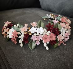 a bunch of flowers that are on top of a couch