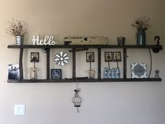 a shelf with pictures and other items on it