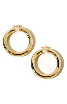 Lightweight and glossy, these 18-karat gold-plated tube hoop earrings will be your go-to pick for a day or night out. 2" hoop diameter Snap-post closure 18k-gold fill Made in the USA of imported materials Chic Polished Round Hoop Earrings, Chic Polished Finish Round Hoop Earrings, Child Of Wild, Tube Hoop Earrings, Earrings In Gold, Wild Child, Made In The Usa, Gold Filled, Silver Plate