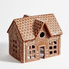 a gingerbread house is shown on a white background