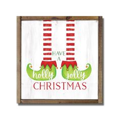 a wooden sign with two christmas stockings hanging from it's sides and the words have holly