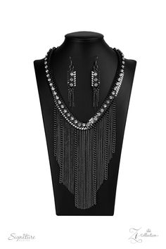 A sassy curtain of mismatched gunmetal chains tapers from the bottom of a dramatic row of glassy white rhinestones that have been delicately fastened to an edgy row of flattened gunmetal chain. The exaggerated fringe cascades down the chest, resulting in a dauntless attitude that demands attention with every swish of the fearless fringe. Features an adjustable clasp closure. Named after 2020 Rock the Runway winner, Alex M. Sold as one individual necklace. Includes one pair of matching earrings. Alex White, Edgy Wedding, Paparazzi Consultant, Signature Necklace, Paparazzi Accessories, White Rhinestone, Paparazzi Jewelry, Signature Collection, Boutique Jewelry