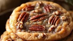 three pecan cookies stacked on top of each other