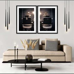 two black and white pictures hanging above a couch