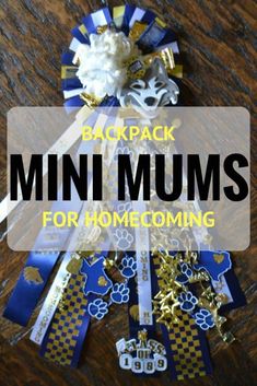 the back pack for mini mums is shown with gold and blue ribbons on it